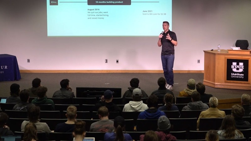 Alex Bean delivering a lecture.